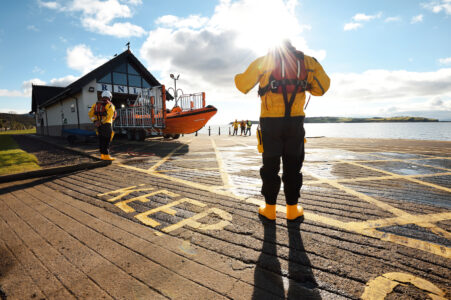 Disabled cruiser towed after firing orange flare