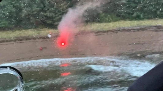 Flare used in Alaska rescue of man and dogs