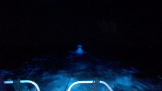 Boat with engine problems signals with flare