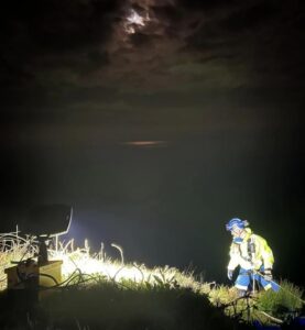 Coastguards use parachute flare to rescue climbers at night